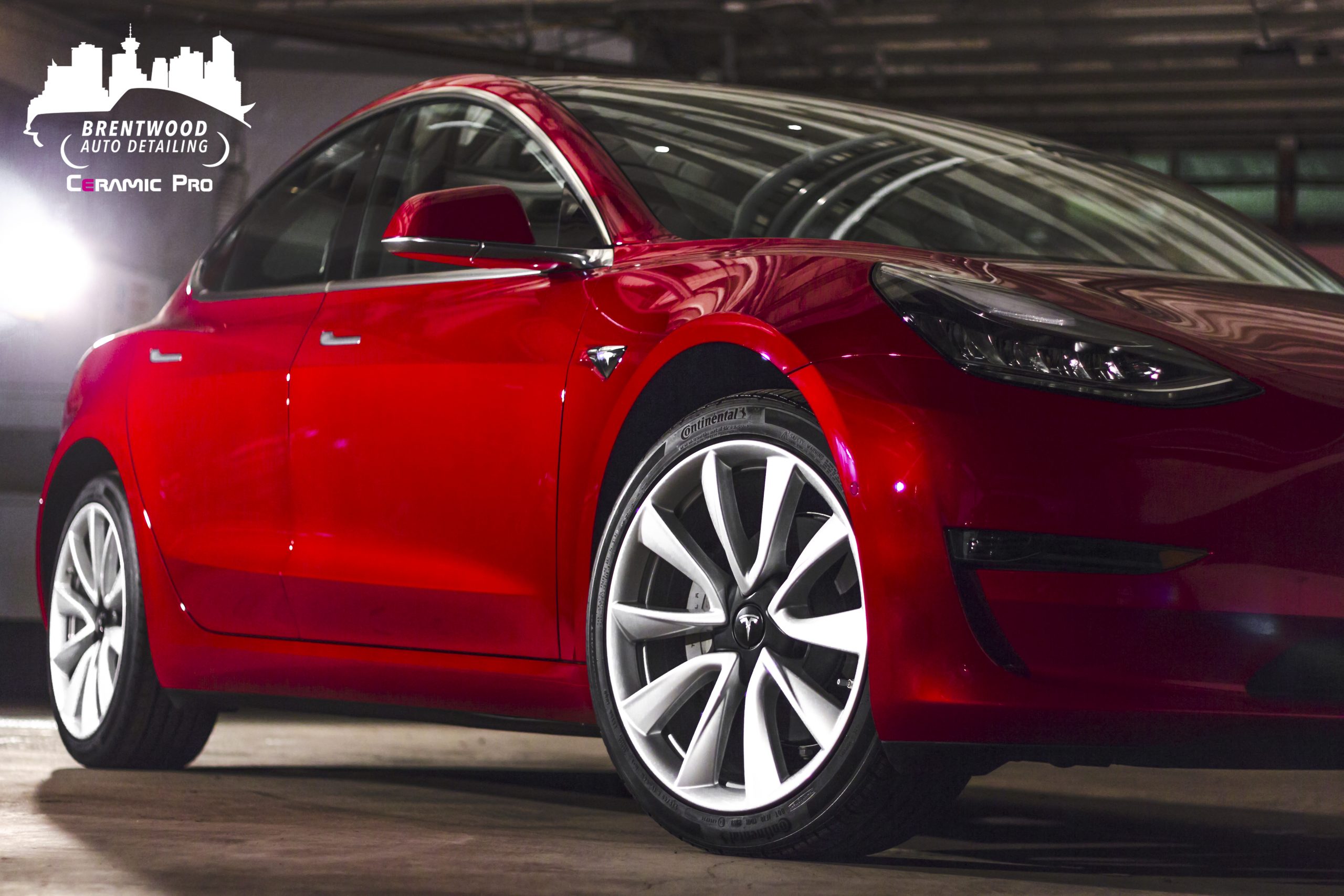 Red Tesla with windows tint by Brentwood Auto Detailing
